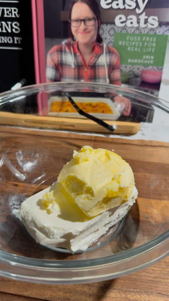butter and cream cheese in glass mixing bowl