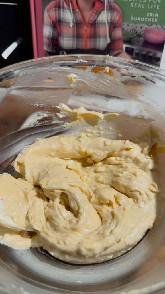 cream cheese and butter mixture in a glass mixing bowl