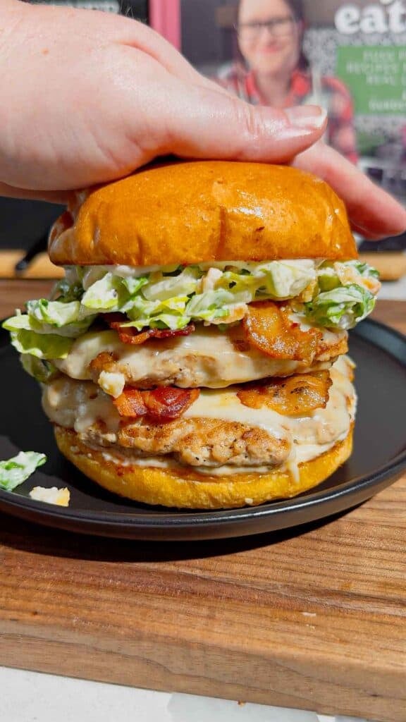 These Chicken Caesar Smash Burgers are the ultimate mashup of a juicy chicken burger and a classic Caesar salad. Made with crispy smashed ground chicken patties, melty mozzarella cheese, smoky bacon, creamy Caesar dressing, crunchy romaine lettuce, parmesan, and croutons on buttery toasted brioche buns, this easy burger recipe is perfect for weeknight dinners, summer cookouts, backyard BBQs, and family meals. If you're looking for smash burger recipes, chicken burger recipes, ground chicken recipes, easy dinner ideas, burger night inspiration, or restaurant-style burgers you can make at home, this Chicken Caesar Smash Burger recipe delivers big flavor with simple ingredients. Save this easy chicken smash burger recipe for your next cookout, game day, or quick dinner everyone will rave about!