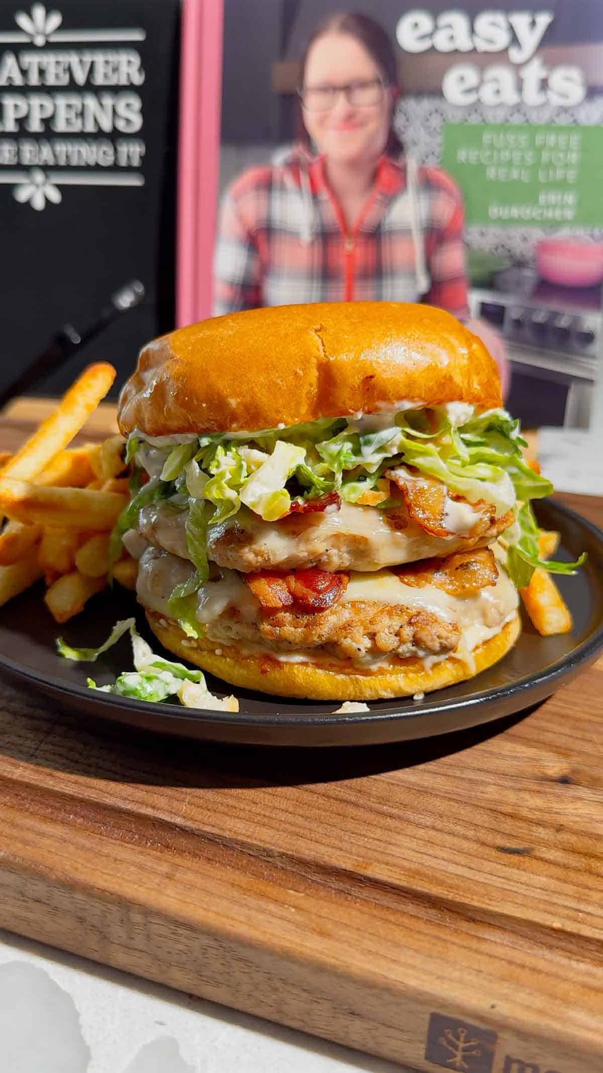 These Chicken Caesar Smash Burgers are the ultimate mashup of a juicy chicken burger and a classic Caesar salad. Made with crispy smashed ground chicken patties, melty mozzarella cheese, smoky bacon, creamy Caesar dressing, crunchy romaine lettuce, parmesan, and croutons on buttery toasted brioche buns, this easy burger recipe is perfect for weeknight dinners, summer cookouts, backyard BBQs, and family meals. If you're looking for smash burger recipes, chicken burger recipes, ground chicken recipes, easy dinner ideas, burger night inspiration, or restaurant-style burgers you can make at home, this Chicken Caesar Smash Burger recipe delivers big flavor with simple ingredients. Save this easy chicken smash burger recipe for your next cookout, game day, or quick dinner everyone will rave about!