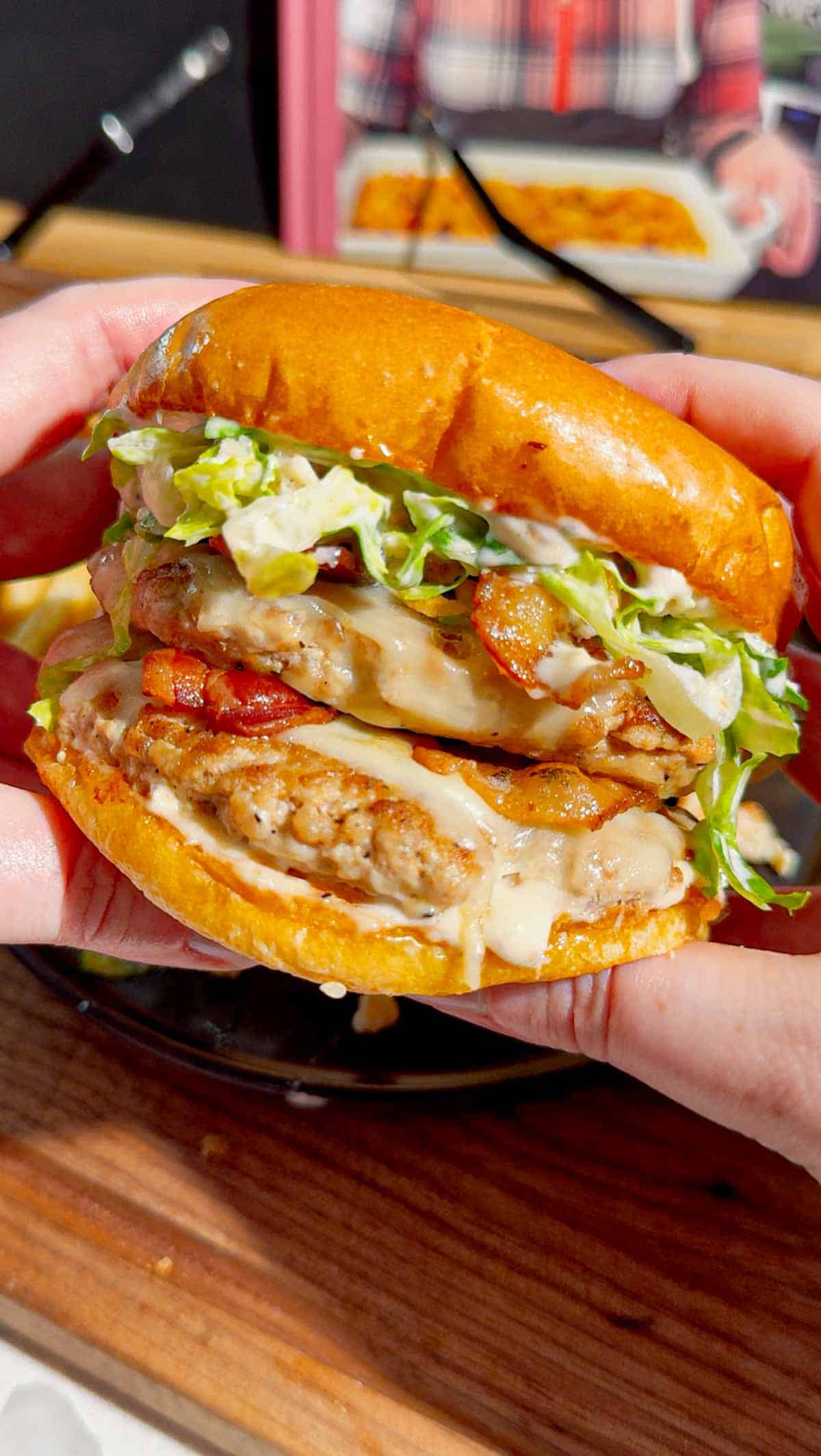 These Chicken Caesar Smash Burgers are the ultimate mashup of a juicy chicken burger and a classic Caesar salad. Made with crispy smashed ground chicken patties, melty mozzarella cheese, smoky bacon, creamy Caesar dressing, crunchy romaine lettuce, parmesan, and croutons on buttery toasted brioche buns, this easy burger recipe is perfect for weeknight dinners, summer cookouts, backyard BBQs, and family meals. If you're looking for smash burger recipes, chicken burger recipes, ground chicken recipes, easy dinner ideas, burger night inspiration, or restaurant-style burgers you can make at home, this Chicken Caesar Smash Burger recipe delivers big flavor with simple ingredients. Save this easy chicken smash burger recipe for your next cookout, game day, or quick dinner everyone will rave about!