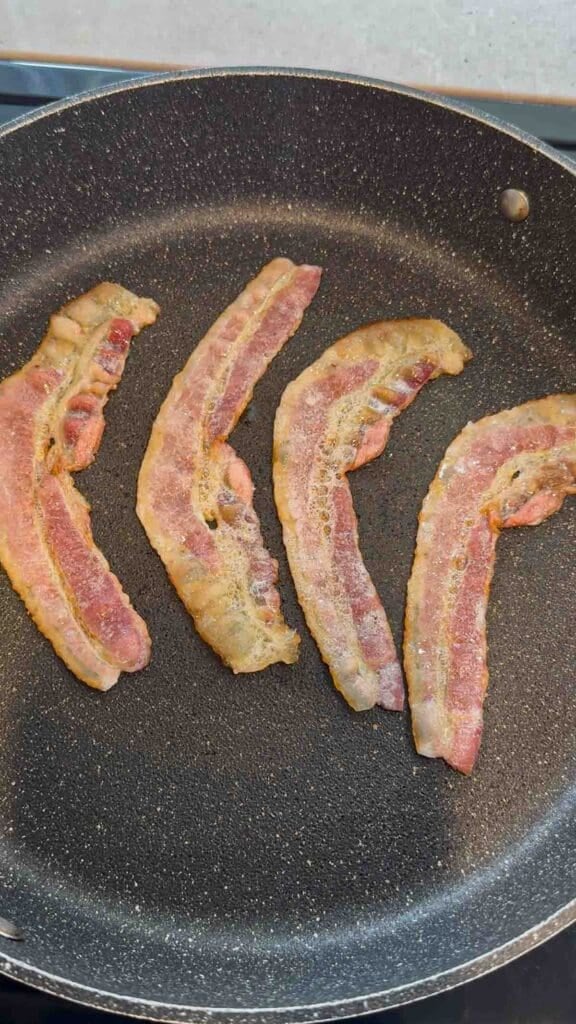 bacon strips in a skillet