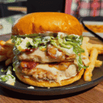 These Chicken Caesar Smash Burgers are the ultimate mashup of a juicy chicken burger and a classic Caesar salad. Made with crispy smashed ground chicken patties, melty mozzarella cheese, smoky bacon, creamy Caesar dressing, crunchy romaine lettuce, parmesan, and croutons on buttery toasted brioche buns, this easy burger recipe is perfect for weeknight dinners, summer cookouts, backyard BBQs, and family meals. If you're looking for smash burger recipes, chicken burger recipes, ground chicken recipes, easy dinner ideas, burger night inspiration, or restaurant-style burgers you can make at home, this Chicken Caesar Smash Burger recipe delivers big flavor with simple ingredients. Save this easy chicken smash burger recipe for your next cookout, game day, or quick dinner everyone will rave about!