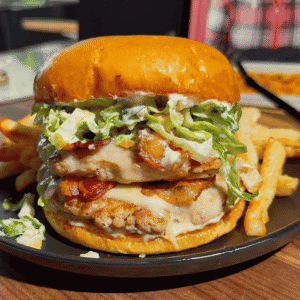 These Chicken Caesar Smash Burgers are the ultimate mashup of a juicy chicken burger and a classic Caesar salad. Made with crispy smashed ground chicken patties, melty mozzarella cheese, smoky bacon, creamy Caesar dressing, crunchy romaine lettuce, parmesan, and croutons on buttery toasted brioche buns, this easy burger recipe is perfect for weeknight dinners, summer cookouts, backyard BBQs, and family meals. If you're looking for smash burger recipes, chicken burger recipes, ground chicken recipes, easy dinner ideas, burger night inspiration, or restaurant-style burgers you can make at home, this Chicken Caesar Smash Burger recipe delivers big flavor with simple ingredients. Save this easy chicken smash burger recipe for your next cookout, game day, or quick dinner everyone will rave about!