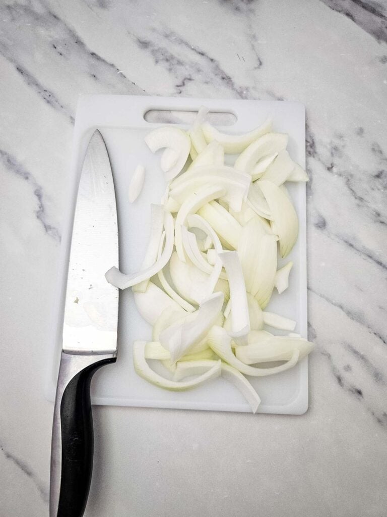 sliced onions on a cutting board