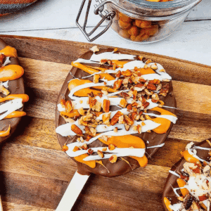 These Chocolate Caramel Apple Slice Pops are an easy fall treat combining crisp Granny Smith apples with rich chocolate, gooey caramel, white chocolate drizzle, and crunchy pecans. If you love Caramel Apple Slices, Chocolate Covered Apple Slices, or classic Caramel Apples, this simple recipe is a must-try. These Apple Slice Pops are perfect for Fall Desserts, Halloween Treats, Thanksgiving Desserts, Fall Party Food. Learn How To Make Chocolate Covered Apples with an easy twist that is less messy than whole apples. These Chocolate Caramel Apples are sweet, tart, and crunchy in every bite. Save this Easy Fall Dessert Recipe for apple season, Halloween parties, Thanksgiving, or anytime you need Easy Apple Desserts, Fall Treat Ideas, or a fun No Bake Dessert everyone will love.