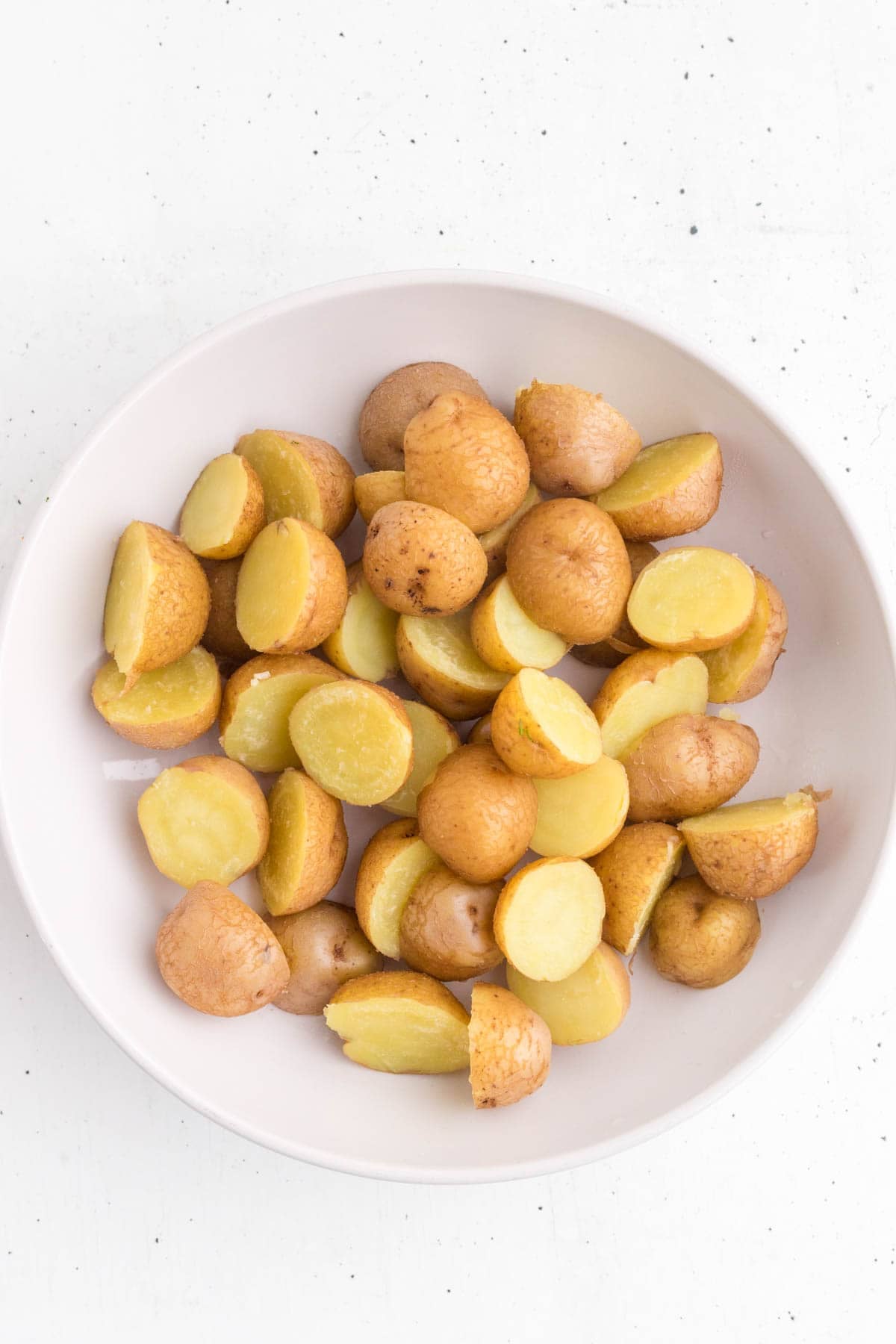 chopped baby potatoes in a bowl