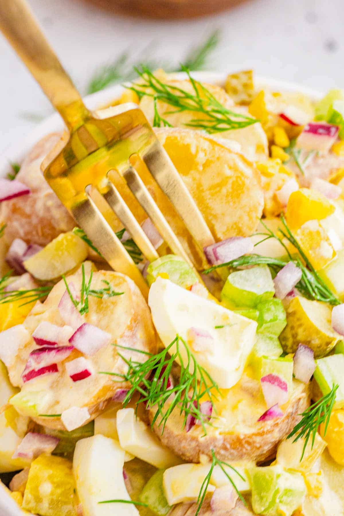 This Dill Pickle Potato Salad is the ultimate creamy and tangy summer side dish for pickle lovers! Tender baby potatoes are tossed with crunchy dill pickles, crisp celery, red onion, fresh dill, and chopped hard-boiled eggs for a flavor-packed twist on Classic Potato Salad. A creamy dressing made with mayonnaise, dill pickle juice, yellow mustard, and red wine vinegar gives this Easy Potato Salad Recipe plenty of zippy pickle flavor. Serve this Dill Pickle Potato Salad Recipe at summer BBQs, backyard cookouts, picnics, potlucks, family dinners, or holiday gatherings. If you're searching for Easy Summer Side Dishes, BBQ Side Dishes, Cold Potato Salad Recipes, Dill Pickle Recipes, Picnic Side Dishes, or the Best Potato Salad Recipe, save this creamy potato salad for later!