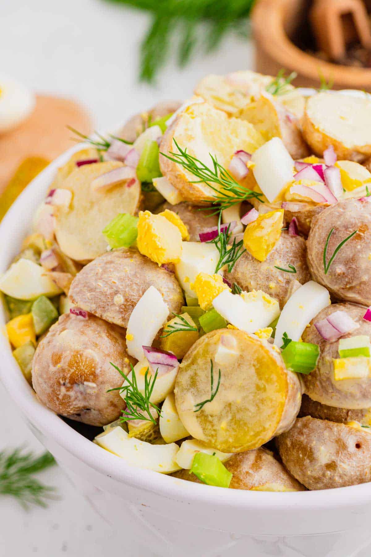 This Dill Pickle Potato Salad is the ultimate creamy and tangy summer side dish for pickle lovers! Tender baby potatoes are tossed with crunchy dill pickles, crisp celery, red onion, fresh dill, and chopped hard-boiled eggs for a flavor-packed twist on Classic Potato Salad. A creamy dressing made with mayonnaise, dill pickle juice, yellow mustard, and red wine vinegar gives this Easy Potato Salad Recipe plenty of zippy pickle flavor. Serve this Dill Pickle Potato Salad Recipe at summer BBQs, backyard cookouts, picnics, potlucks, family dinners, or holiday gatherings. If you're searching for Easy Summer Side Dishes, BBQ Side Dishes, Cold Potato Salad Recipes, Dill Pickle Recipes, Picnic Side Dishes, or the Best Potato Salad Recipe, save this creamy potato salad for later!