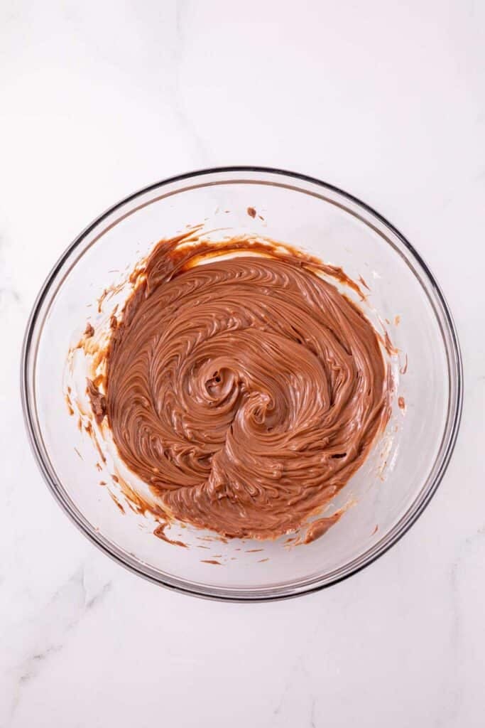 nutella and butter creamed together in a mixing bowl