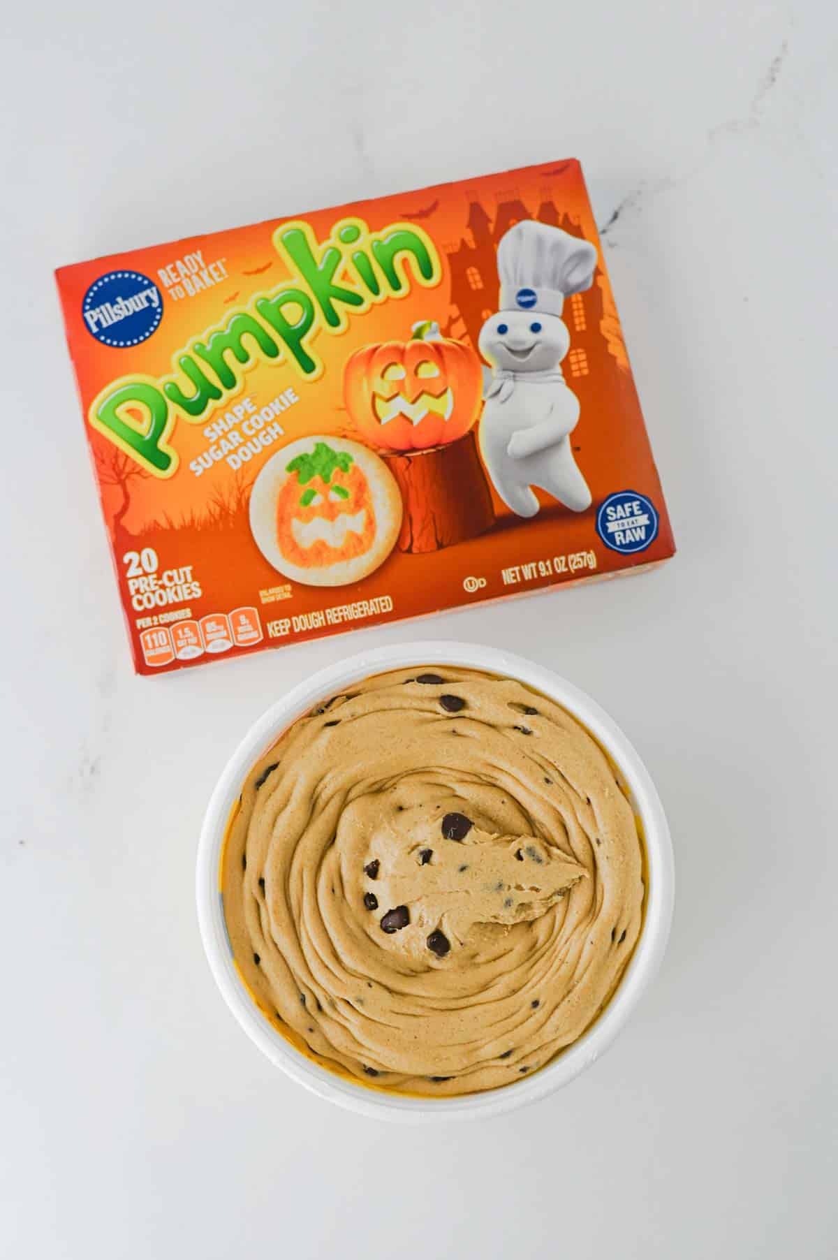 pillsbury halloween pumpkin sugar cookie dough and chocolate chip cookie dough on the kitchen counter