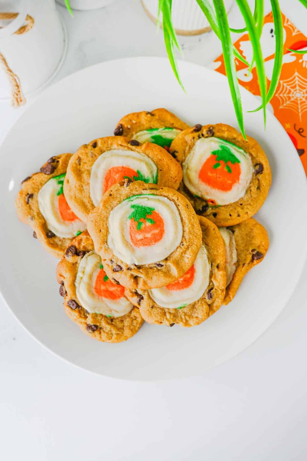 These Easy Halloween Cookies are the ultimate spooky season treat when you need something cute, festive, and incredibly simple! Made with just two ingredients, these Halloween cookies combine classic chocolate chip cookie dough with Pillsbury Pumpkin Shaped Cookies for an adorable two-in-one dessert. If you're searching for Easy Halloween Cookies, Halloween Cookie Ideas, Halloween Treats For Kids, Pillsbury Halloween Cookies, Easy Halloween Desserts, Fall Cookie Recipes, Pumpkin Cookies, or Halloween Party Food, you'll love this shortcut recipe. They bake in just 10 minutes and are perfect for Halloween parties, school treats, fall gatherings, movie nights, and October baking with kids. Save these easy Halloween cookies for a fun spooky treat everyone will love!