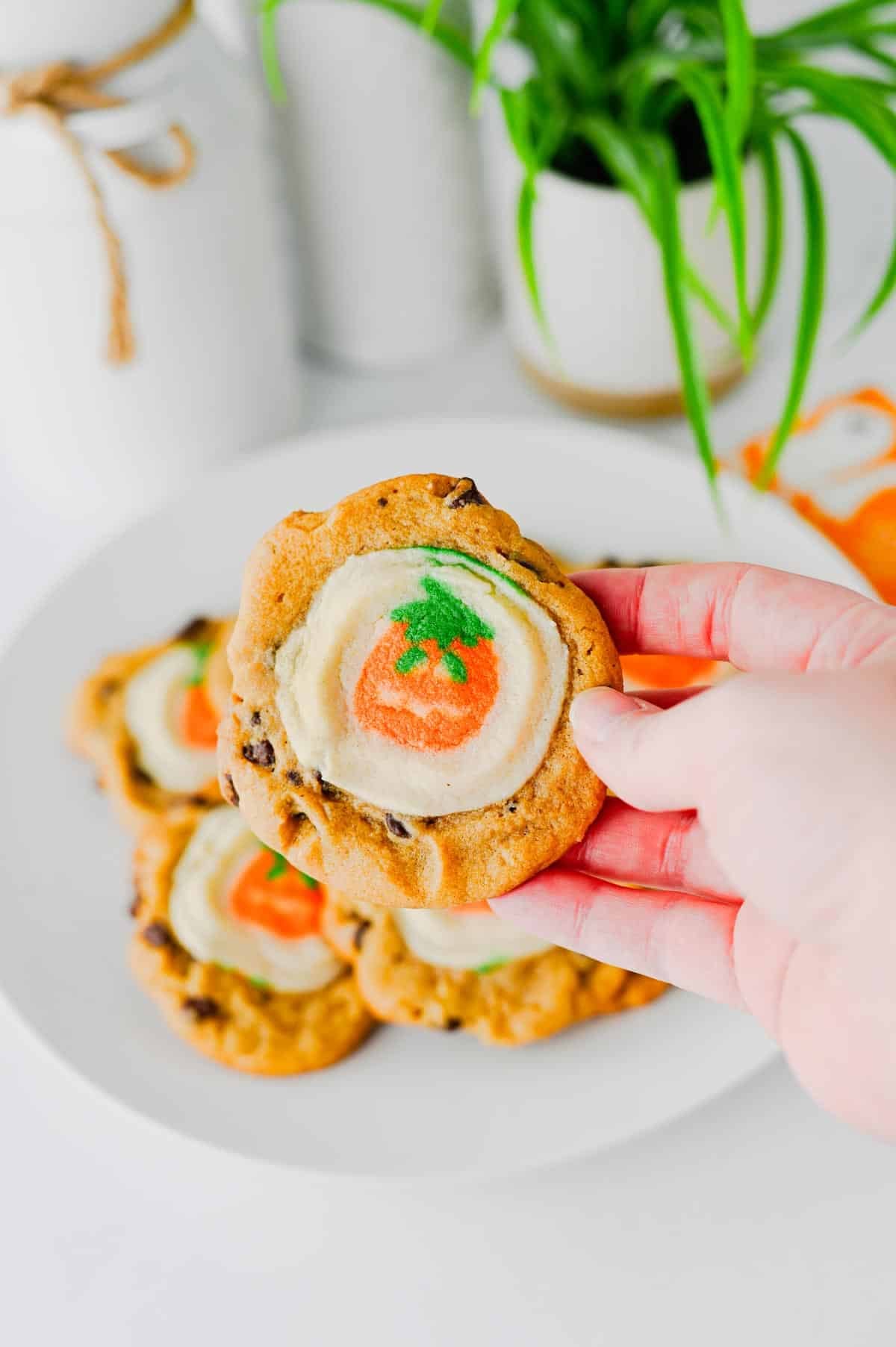 These Easy Halloween Cookies are the ultimate spooky season treat when you need something cute, festive, and incredibly simple! Made with just two ingredients, these Halloween cookies combine classic chocolate chip cookie dough with Pillsbury Pumpkin Shaped Cookies for an adorable two-in-one dessert. If you're searching for Easy Halloween Cookies, Halloween Cookie Ideas, Halloween Treats For Kids, Pillsbury Halloween Cookies, Easy Halloween Desserts, Fall Cookie Recipes, Pumpkin Cookies, or Halloween Party Food, you'll love this shortcut recipe. They bake in just 10 minutes and are perfect for Halloween parties, school treats, fall gatherings, movie nights, and October baking with kids. Save these easy Halloween cookies for a fun spooky treat everyone will love!