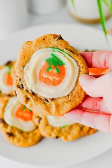 These Easy Halloween Cookies are the ultimate spooky season treat when you need something cute, festive, and incredibly simple! Made with just two ingredients, these Halloween cookies combine classic chocolate chip cookie dough with Pillsbury Pumpkin Shaped Cookies for an adorable two-in-one dessert. If you're searching for Easy Halloween Cookies, Halloween Cookie Ideas, Halloween Treats For Kids, Pillsbury Halloween Cookies, Easy Halloween Desserts, Fall Cookie Recipes, Pumpkin Cookies, or Halloween Party Food, you'll love this shortcut recipe. They bake in just 10 minutes and are perfect for Halloween parties, school treats, fall gatherings, movie nights, and October baking with kids. Save these easy Halloween cookies for a fun spooky treat everyone will love!