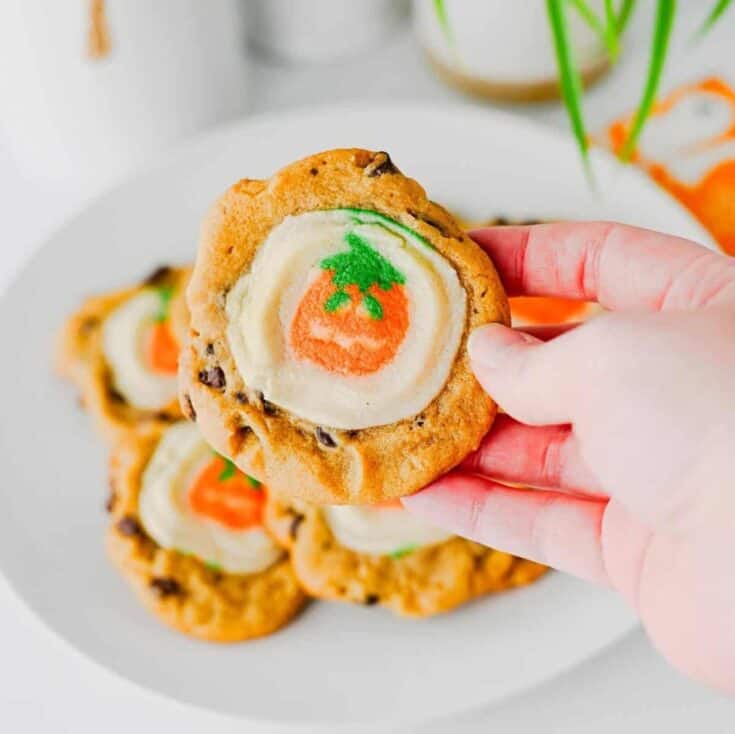 These Easy Halloween Cookies are the ultimate spooky season treat when you need something cute, festive, and incredibly simple! Made with just two ingredients, these Halloween cookies combine classic chocolate chip cookie dough with Pillsbury Pumpkin Shaped Cookies for an adorable two-in-one dessert. If you're searching for Easy Halloween Cookies, Halloween Cookie Ideas, Halloween Treats For Kids, Pillsbury Halloween Cookies, Easy Halloween Desserts, Fall Cookie Recipes, Pumpkin Cookies, or Halloween Party Food, you'll love this shortcut recipe. They bake in just 10 minutes and are perfect for Halloween parties, school treats, fall gatherings, movie nights, and October baking with kids. Save these easy Halloween cookies for a fun spooky treat everyone will love!