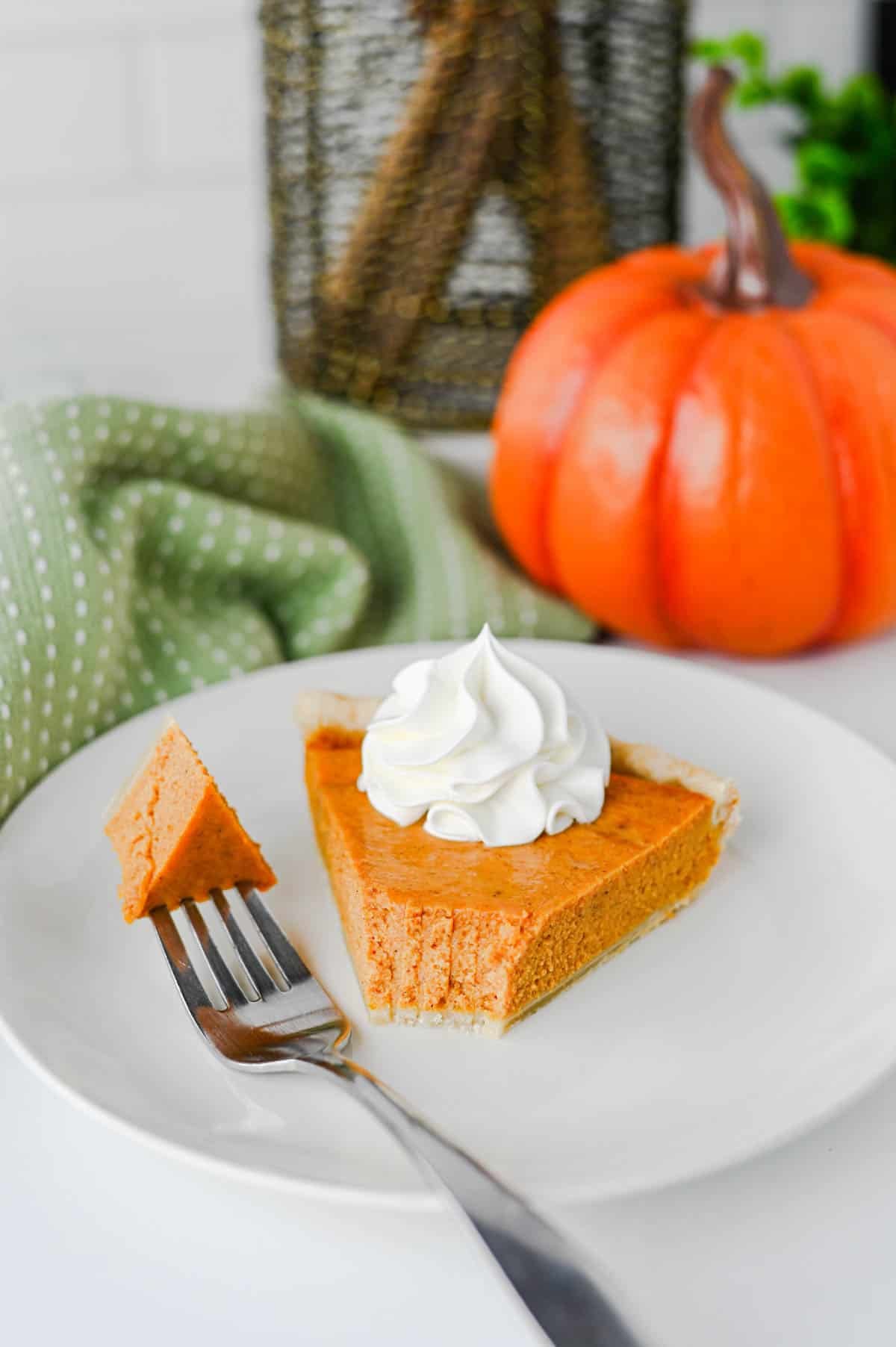This Easy Pumpkin Pie Recipe is the perfect classic fall dessert for Thanksgiving, Christmas, or any cozy autumn gathering! Made with pumpkin puree, sweetened condensed milk, eggs, pumpkin pie spice, and a convenient store bought pie crust, this Homemade Pumpkin Pie is incredibly simple to prepare. If you're looking for Easy Pumpkin Desserts, Thanksgiving Pie Recipes, Pumpkin Puree Recipes, or Fall Baking Ideas, this creamy pie is a must-try. The smooth Pumpkin Pie Filling is warmly spiced and bakes up perfectly in a flaky golden crust. It's an Easy Thanksgiving Dessert that's great for beginner bakers and holiday entertaining. Save this Classic Pumpkin Pie Recipe for your Thanksgiving menu, fall baking list, or whenever you're craving an Easy Pumpkin Dessert that's rich, creamy, and full of pumpkin spice flavor!