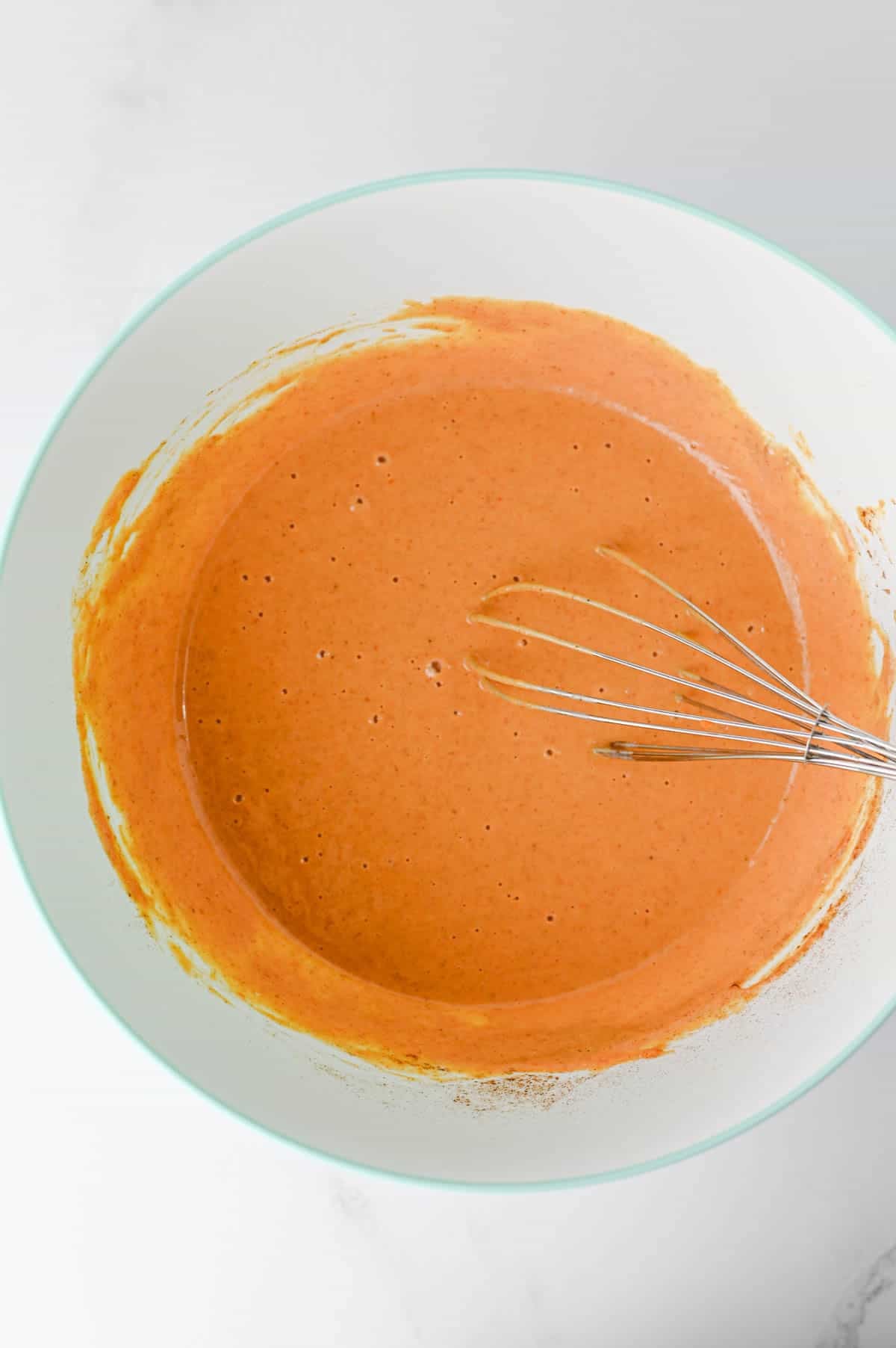 pumpkin pie fillin in a mixing bowl