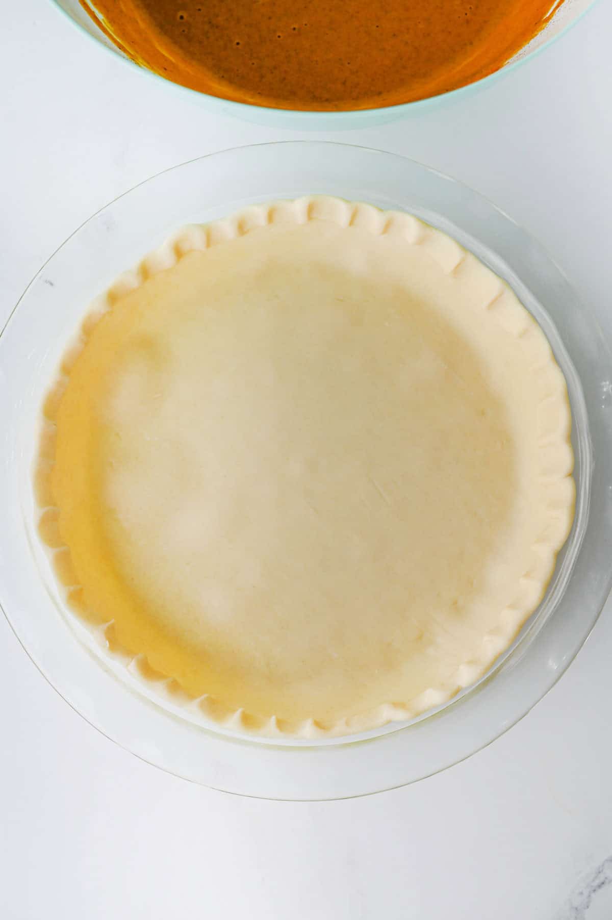 unbaked pie crust on the kitchen counter