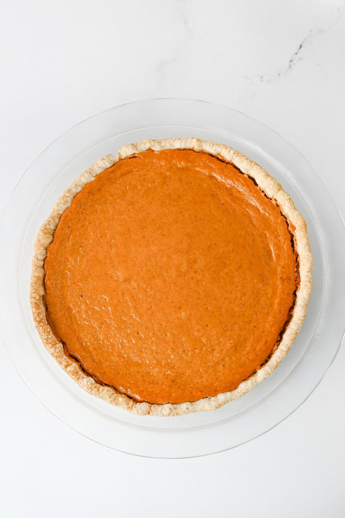 This Easy Pumpkin Pie Recipe is the perfect classic fall dessert for Thanksgiving, Christmas, or any cozy autumn gathering! Made with pumpkin puree, sweetened condensed milk, eggs, pumpkin pie spice, and a convenient store bought pie crust, this Homemade Pumpkin Pie is incredibly simple to prepare. If you're looking for Easy Pumpkin Desserts, Thanksgiving Pie Recipes, Pumpkin Puree Recipes, or Fall Baking Ideas, this creamy pie is a must-try. The smooth Pumpkin Pie Filling is warmly spiced and bakes up perfectly in a flaky golden crust. It's an Easy Thanksgiving Dessert that's great for beginner bakers and holiday entertaining. Save this Classic Pumpkin Pie Recipe for your Thanksgiving menu, fall baking list, or whenever you're craving an Easy Pumpkin Dessert that's rich, creamy, and full of pumpkin spice flavor!