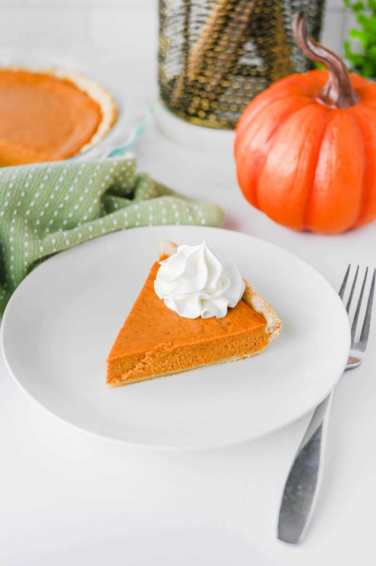 This Easy Pumpkin Pie Recipe is the perfect classic fall dessert for Thanksgiving, Christmas, or any cozy autumn gathering! Made with pumpkin puree, sweetened condensed milk, eggs, pumpkin pie spice, and a convenient store bought pie crust, this Homemade Pumpkin Pie is incredibly simple to prepare. If you're looking for Easy Pumpkin Desserts, Thanksgiving Pie Recipes, Pumpkin Puree Recipes, or Fall Baking Ideas, this creamy pie is a must-try. The smooth Pumpkin Pie Filling is warmly spiced and bakes up perfectly in a flaky golden crust. It's an Easy Thanksgiving Dessert that's great for beginner bakers and holiday entertaining. Save this Classic Pumpkin Pie Recipe for your Thanksgiving menu, fall baking list, or whenever you're craving an Easy Pumpkin Dessert that's rich, creamy, and full of pumpkin spice flavor!