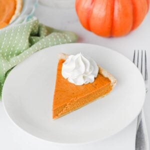 This Easy Pumpkin Pie Recipe is the perfect classic fall dessert for Thanksgiving, Christmas, or any cozy autumn gathering! Made with pumpkin puree, sweetened condensed milk, eggs, pumpkin pie spice, and a convenient store bought pie crust, this Homemade Pumpkin Pie is incredibly simple to prepare. If you're looking for Easy Pumpkin Desserts, Thanksgiving Pie Recipes, Pumpkin Puree Recipes, or Fall Baking Ideas, this creamy pie is a must-try. The smooth Pumpkin Pie Filling is warmly spiced and bakes up perfectly in a flaky golden crust. It's an Easy Thanksgiving Dessert that's great for beginner bakers and holiday entertaining. Save this Classic Pumpkin Pie Recipe for your Thanksgiving menu, fall baking list, or whenever you're craving an Easy Pumpkin Dessert that's rich, creamy, and full of pumpkin spice flavor!