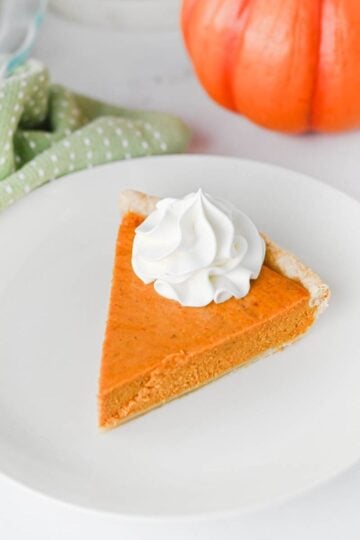 This Easy Pumpkin Pie Recipe is the perfect classic fall dessert for Thanksgiving, Christmas, or any cozy autumn gathering! Made with pumpkin puree, sweetened condensed milk, eggs, pumpkin pie spice, and a convenient store bought pie crust, this Homemade Pumpkin Pie is incredibly simple to prepare. If you're looking for Easy Pumpkin Desserts, Thanksgiving Pie Recipes, Pumpkin Puree Recipes, or Fall Baking Ideas, this creamy pie is a must-try. The smooth Pumpkin Pie Filling is warmly spiced and bakes up perfectly in a flaky golden crust. It's an Easy Thanksgiving Dessert that's great for beginner bakers and holiday entertaining. Save this Classic Pumpkin Pie Recipe for your Thanksgiving menu, fall baking list, or whenever you're craving an Easy Pumpkin Dessert that's rich, creamy, and full of pumpkin spice flavor!