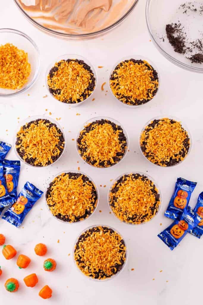 toased coconut on top of dirt pudding cups