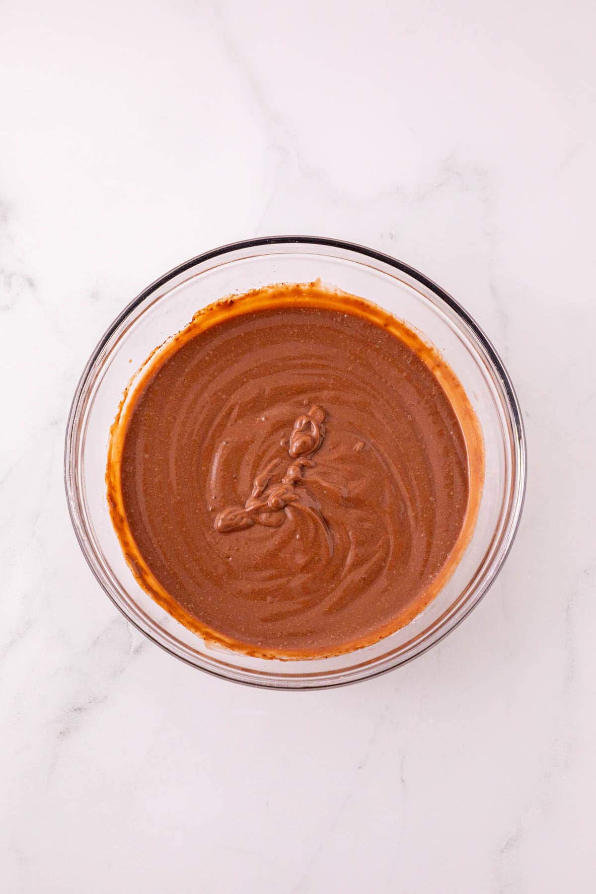 chocolate pudding in a glass mixing bowl