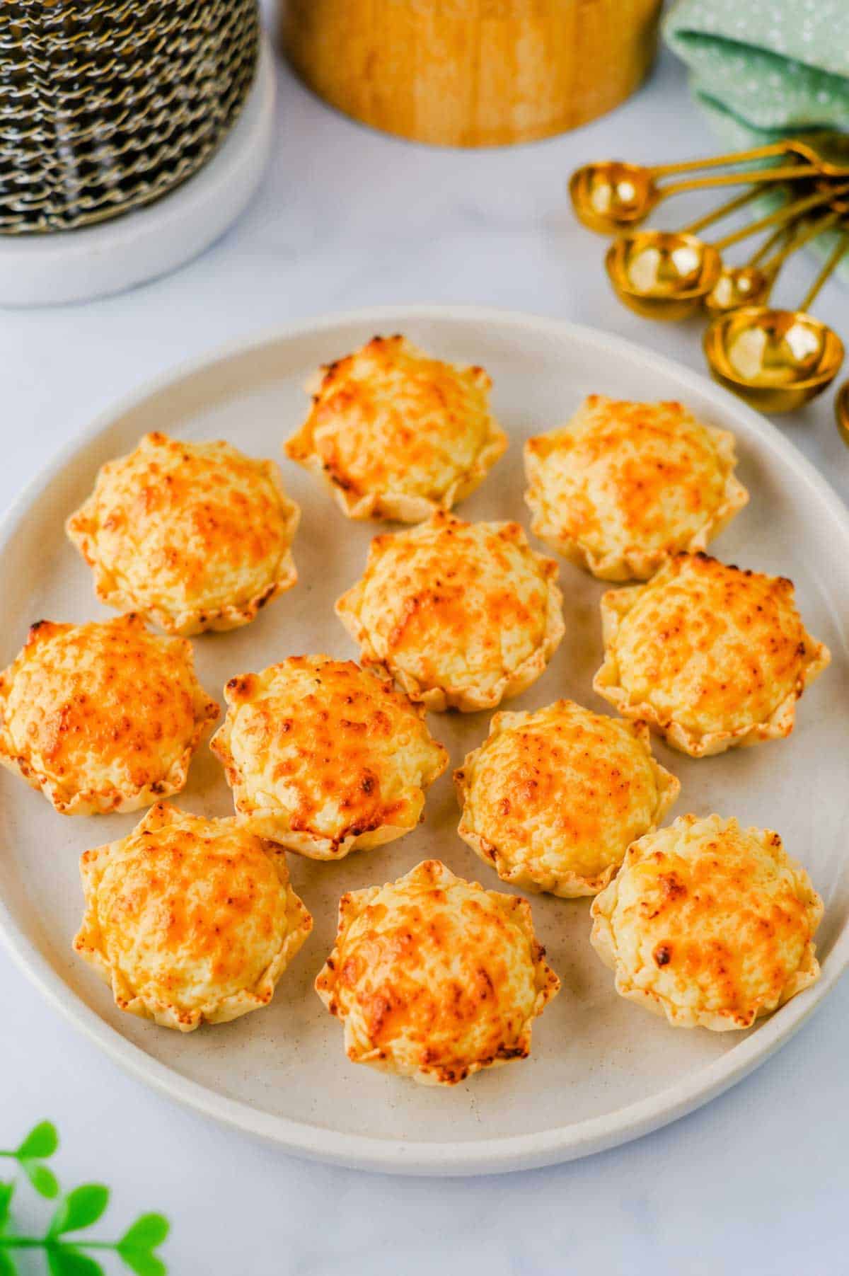 These Iowa Party Bites are the ultimate easy appetizer for game day, holiday parties, potlucks, and family gatherings! Crispy Tostitos Scoops are filled with a creamy, cheesy mixture of cream cheese, mozzarella, sweet corn, green chiles, and savory seasonings, then topped with Parmesan and baked until golden and bubbly. This Iowa Party Bites Recipe is perfect when you need easy party appetizers, bite sized appetizers, finger foods, or quick game day snacks that everyone will grab by the handful. Add these cheesy corn bites to your favorite party food ideas, football appetizers, tailgate snacks, Super Bowl appetizers, or holiday appetizer recipes. With simple ingredients and just 15 minutes of baking time, these warm tortilla chip bites are an easy crowd pleasing appetizer for any occasion!
