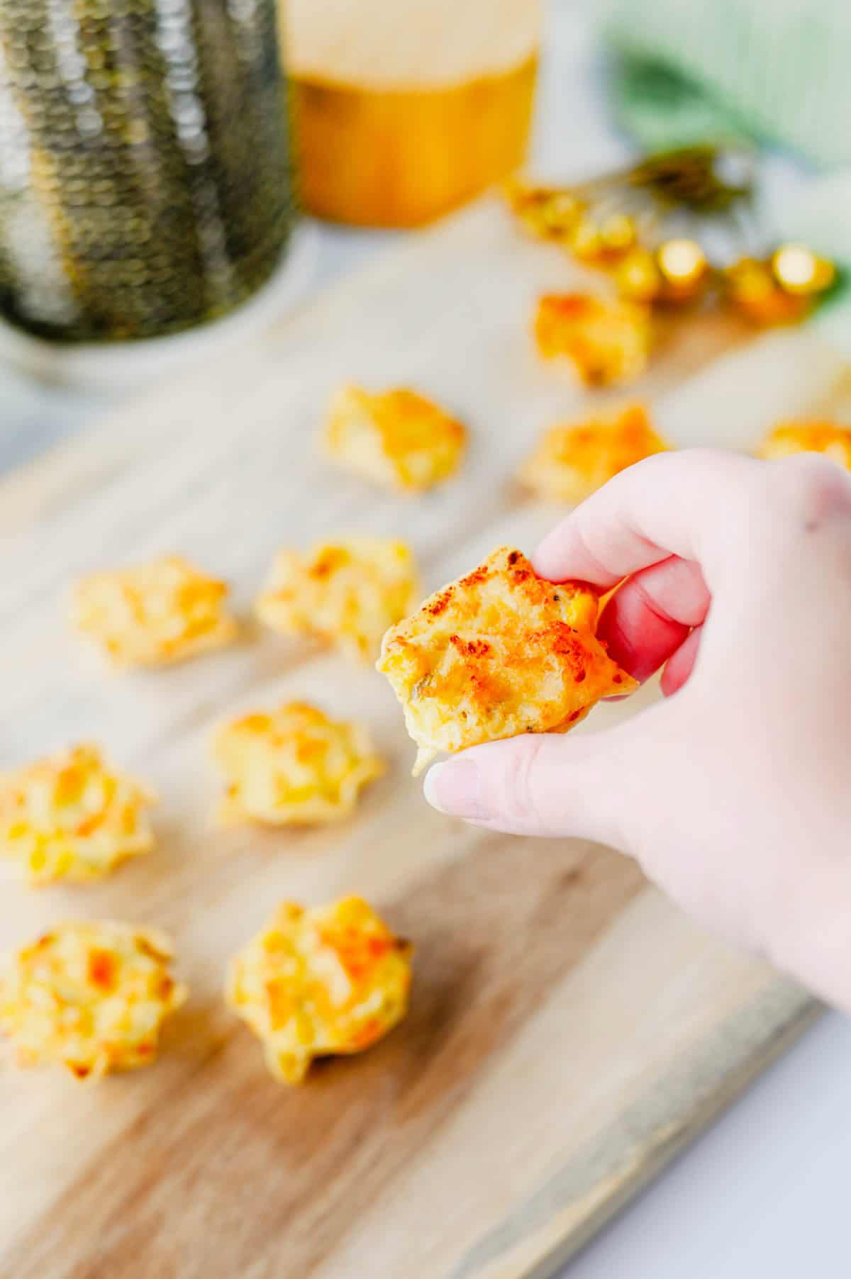 These Iowa Party Bites are the ultimate easy appetizer for game day, holiday parties, potlucks, and family gatherings! Crispy Tostitos Scoops are filled with a creamy, cheesy mixture of cream cheese, mozzarella, sweet corn, green chiles, and savory seasonings, then topped with Parmesan and baked until golden and bubbly. This Iowa Party Bites Recipe is perfect when you need easy party appetizers, bite sized appetizers, finger foods, or quick game day snacks that everyone will grab by the handful. Add these cheesy corn bites to your favorite party food ideas, football appetizers, tailgate snacks, Super Bowl appetizers, or holiday appetizer recipes. With simple ingredients and just 15 minutes of baking time, these warm tortilla chip bites are an easy crowd pleasing appetizer for any occasion!