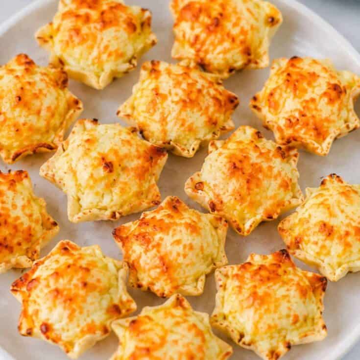 These Iowa Party Bites are the ultimate easy appetizer for game day, holiday parties, potlucks, and family gatherings! Crispy Tostitos Scoops are filled with a creamy, cheesy mixture of cream cheese, mozzarella, sweet corn, green chiles, and savory seasonings, then topped with Parmesan and baked until golden and bubbly. This Iowa Party Bites Recipe is perfect when you need easy party appetizers, bite sized appetizers, finger foods, or quick game day snacks that everyone will grab by the handful. Add these cheesy corn bites to your favorite party food ideas, football appetizers, tailgate snacks, Super Bowl appetizers, or holiday appetizer recipes. With simple ingredients and just 15 minutes of baking time, these warm tortilla chip bites are an easy crowd pleasing appetizer for any occasion!