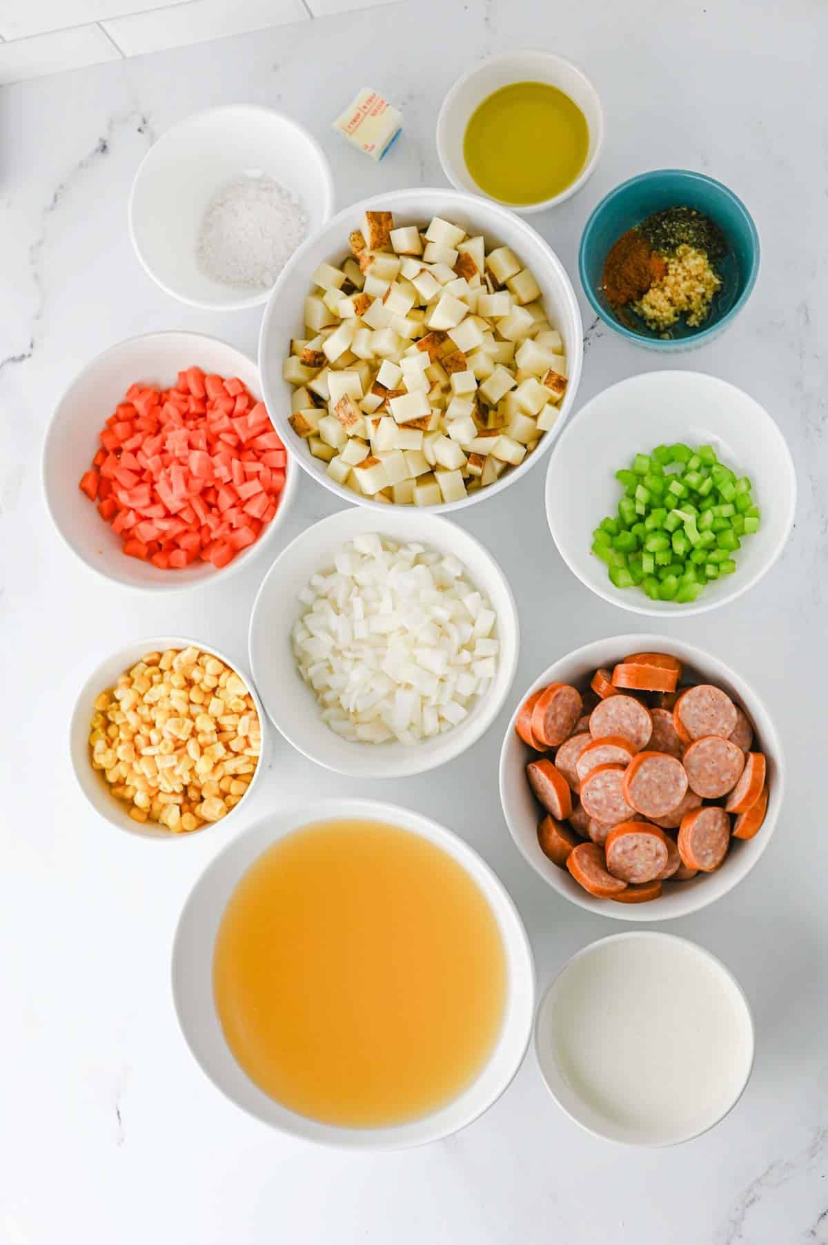 kielbasa potato soup ingredients on the kitchen counter