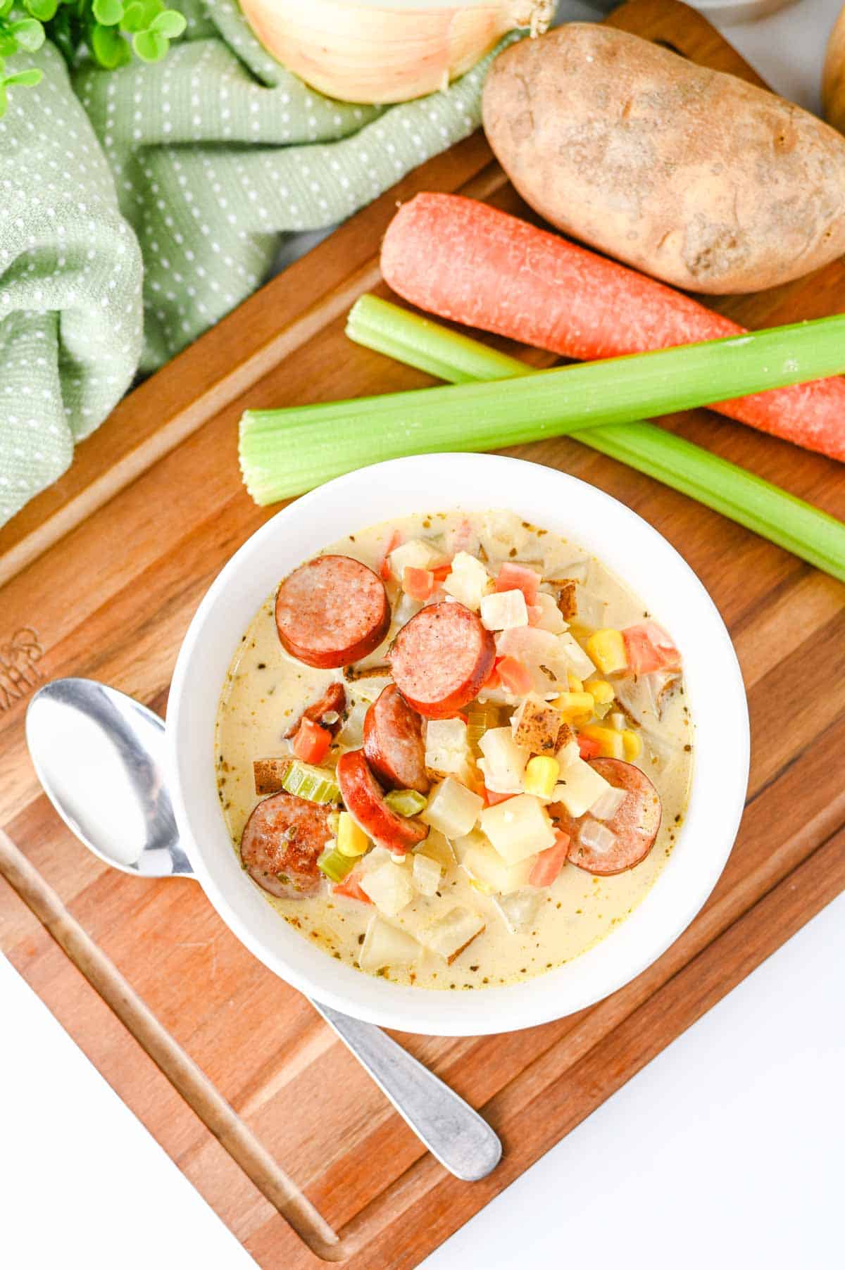 This Kielbasa Potato Soup is a hearty, creamy comfort food dinner loaded with smoky sausage, tender potatoes, carrots, celery, corn, and savory flavor. If you're searching for an Easy Kielbasa Soup, Creamy Potato Soup, Sausage Potato Soup, or cozy Fall Soup Recipe, this simple one pot meal is perfect for busy weeknights. Crispy kielbasa adds delicious smoky flavor to a rich chicken broth and heavy cream base, while russet potatoes make every spoonful filling and satisfying. This easy Potato Soup with Kielbasa is a great choice for cold weather dinners, family meals, and comforting Winter Soup Recipes. Add this creamy Kielbasa Sausage Soup to your list of Easy Soup Recipes, Hearty Soup Recipes, Potato Soup Recipes, and cozy dinner ideas. Save this recipe for a satisfying meal!