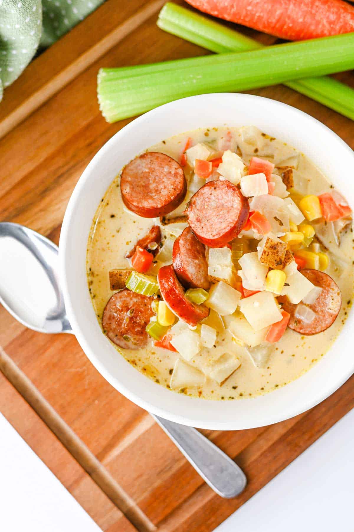 This Kielbasa Potato Soup is a hearty, creamy comfort food dinner loaded with smoky sausage, tender potatoes, carrots, celery, corn, and savory flavor. If you're searching for an Easy Kielbasa Soup, Creamy Potato Soup, Sausage Potato Soup, or cozy Fall Soup Recipe, this simple one pot meal is perfect for busy weeknights. Crispy kielbasa adds delicious smoky flavor to a rich chicken broth and heavy cream base, while russet potatoes make every spoonful filling and satisfying. This easy Potato Soup with Kielbasa is a great choice for cold weather dinners, family meals, and comforting Winter Soup Recipes. Add this creamy Kielbasa Sausage Soup to your list of Easy Soup Recipes, Hearty Soup Recipes, Potato Soup Recipes, and cozy dinner ideas. Save this recipe for a satisfying meal!