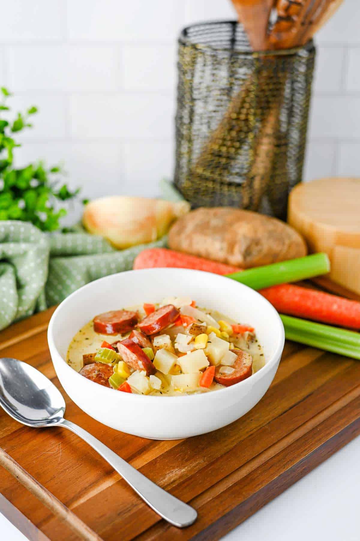 This Kielbasa Potato Soup is a hearty, creamy comfort food dinner loaded with smoky sausage, tender potatoes, carrots, celery, corn, and savory flavor. If you're searching for an Easy Kielbasa Soup, Creamy Potato Soup, Sausage Potato Soup, or cozy Fall Soup Recipe, this simple one pot meal is perfect for busy weeknights. Crispy kielbasa adds delicious smoky flavor to a rich chicken broth and heavy cream base, while russet potatoes make every spoonful filling and satisfying. This easy Potato Soup with Kielbasa is a great choice for cold weather dinners, family meals, and comforting Winter Soup Recipes. Add this creamy Kielbasa Sausage Soup to your list of Easy Soup Recipes, Hearty Soup Recipes, Potato Soup Recipes, and cozy dinner ideas. Save this recipe for a satisfying meal!