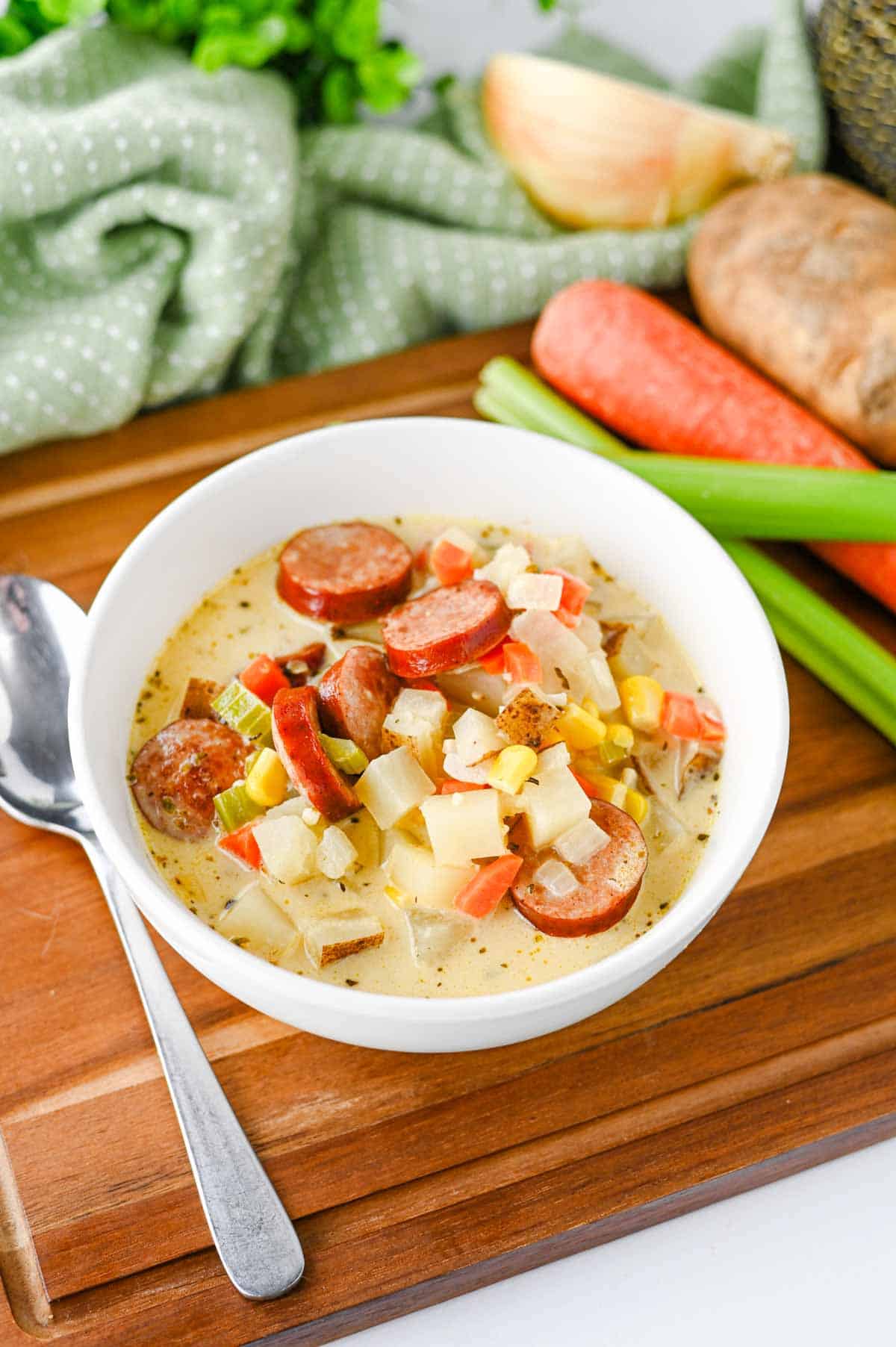This Kielbasa Potato Soup is a hearty, creamy comfort food dinner loaded with smoky sausage, tender potatoes, carrots, celery, corn, and savory flavor. If you're searching for an Easy Kielbasa Soup, Creamy Potato Soup, Sausage Potato Soup, or cozy Fall Soup Recipe, this simple one pot meal is perfect for busy weeknights. Crispy kielbasa adds delicious smoky flavor to a rich chicken broth and heavy cream base, while russet potatoes make every spoonful filling and satisfying. This easy Potato Soup with Kielbasa is a great choice for cold weather dinners, family meals, and comforting Winter Soup Recipes. Add this creamy Kielbasa Sausage Soup to your list of Easy Soup Recipes, Hearty Soup Recipes, Potato Soup Recipes, and cozy dinner ideas. Save this recipe for a satisfying meal!