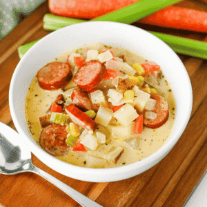 This Kielbasa Potato Soup is a hearty, creamy comfort food dinner loaded with smoky sausage, tender potatoes, carrots, celery, corn, and savory flavor. If you're searching for an Easy Kielbasa Soup, Creamy Potato Soup, Sausage Potato Soup, or cozy Fall Soup Recipe, this simple one pot meal is perfect for busy weeknights. Crispy kielbasa adds delicious smoky flavor to a rich chicken broth and heavy cream base, while russet potatoes make every spoonful filling and satisfying. This easy Potato Soup with Kielbasa is a great choice for cold weather dinners, family meals, and comforting Winter Soup Recipes. Add this creamy Kielbasa Sausage Soup to your list of Easy Soup Recipes, Hearty Soup Recipes, Potato Soup Recipes, and cozy dinner ideas. Save this recipe for a satisfying meal!