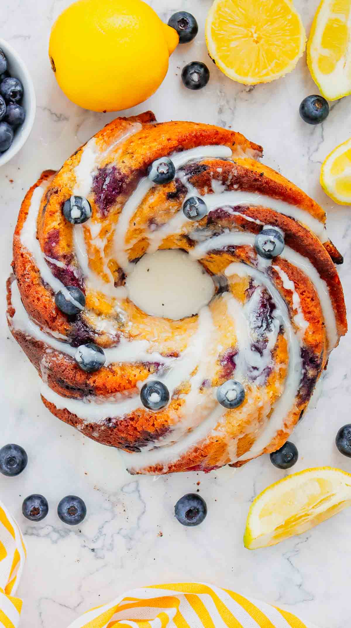 This Lemon Blueberry Bundt Cake is a moist, fluffy dessert bursting with juicy blueberries and fresh lemon flavor in every bite. If you’re searching for an Easy Lemon Blueberry Bundt Cake, Blueberry Lemon Cake, Lemon Bundt Cake Recipe, or Fresh Blueberry Dessert, this simple homemade cake is a must-try. Greek yogurt keeps the cake tender and moist while lemon zest adds the perfect bright citrus flavor. A sweet powdered sugar glaze finishes this beautiful Blueberry Bundt Cake and makes it perfect for spring baking, Easter dessert, Mother’s Day brunch, summer parties, potlucks, or afternoon coffee. Save this Lemon Blueberry Cake Recipe when you need Easy Bundt Cake Recipes, Lemon Desserts, Blueberry Desserts, Spring Cake Recipes, or a delicious dessert using fresh blueberries!