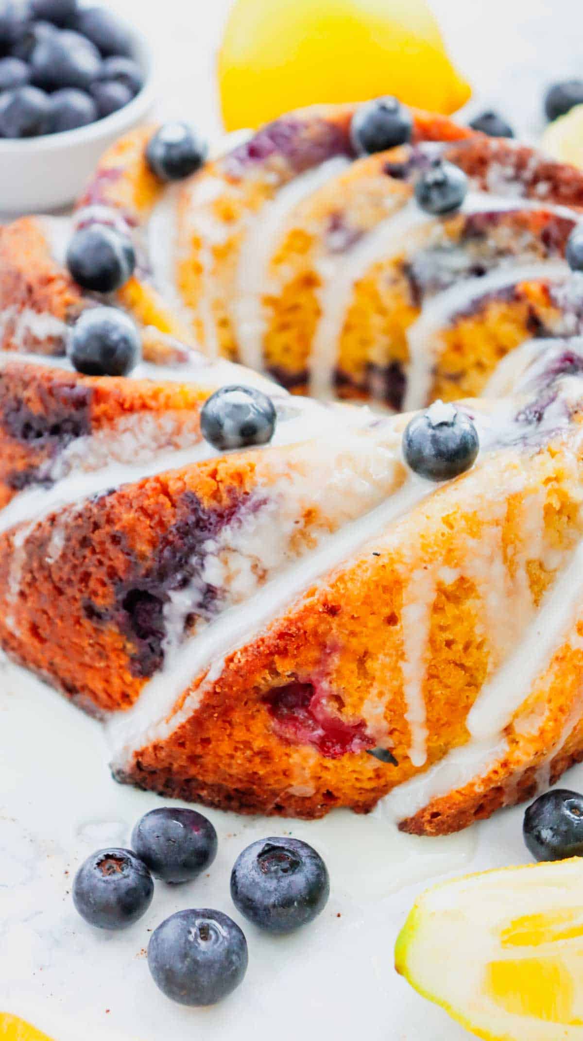 This Lemon Blueberry Bundt Cake is a moist, fluffy dessert bursting with juicy blueberries and fresh lemon flavor in every bite. If you’re searching for an Easy Lemon Blueberry Bundt Cake, Blueberry Lemon Cake, Lemon Bundt Cake Recipe, or Fresh Blueberry Dessert, this simple homemade cake is a must-try. Greek yogurt keeps the cake tender and moist while lemon zest adds the perfect bright citrus flavor. A sweet powdered sugar glaze finishes this beautiful Blueberry Bundt Cake and makes it perfect for spring baking, Easter dessert, Mother’s Day brunch, summer parties, potlucks, or afternoon coffee. Save this Lemon Blueberry Cake Recipe when you need Easy Bundt Cake Recipes, Lemon Desserts, Blueberry Desserts, Spring Cake Recipes, or a delicious dessert using fresh blueberries!