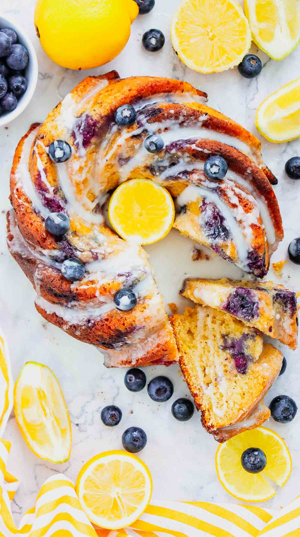 This Lemon Blueberry Bundt Cake is a moist, fluffy dessert bursting with juicy blueberries and fresh lemon flavor in every bite. If you’re searching for an Easy Lemon Blueberry Bundt Cake, Blueberry Lemon Cake, Lemon Bundt Cake Recipe, or Fresh Blueberry Dessert, this simple homemade cake is a must-try. Greek yogurt keeps the cake tender and moist while lemon zest adds the perfect bright citrus flavor. A sweet powdered sugar glaze finishes this beautiful Blueberry Bundt Cake and makes it perfect for spring baking, Easter dessert, Mother’s Day brunch, summer parties, potlucks, or afternoon coffee. Save this Lemon Blueberry Cake Recipe when you need Easy Bundt Cake Recipes, Lemon Desserts, Blueberry Desserts, Spring Cake Recipes, or a delicious dessert using fresh blueberries!