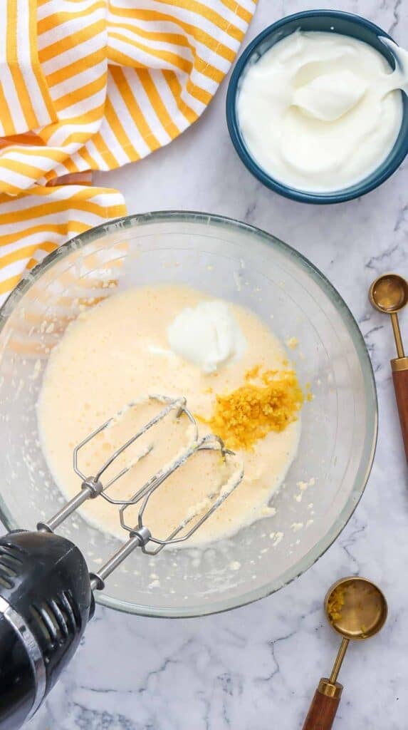 lemon zest added to mixing bowl with wet ingredients