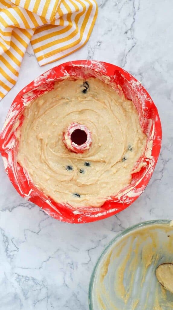 lemon blueberry cake batter in a bundt pan