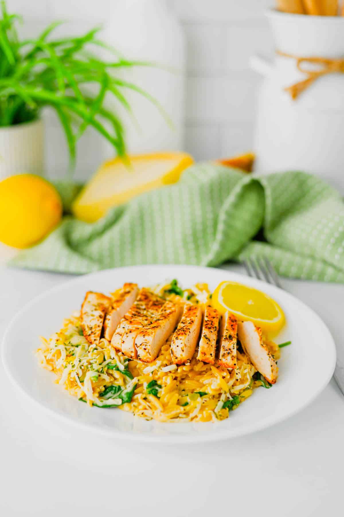 This Lemon Chicken Orzo is the perfect easy dinner when you’re craving creamy comfort food with a fresh, zesty twist! Tender seasoned chicken breast is served over creamy Parmesan orzo with baby spinach, garlic, Italian seasoning, heavy cream, fresh lemon juice and lemon zest. This easy Lemon Chicken Orzo Recipe comes together in one skillet in about 30 minutes, making it perfect for busy weeknights and simple family dinners. If you love One Pan Chicken Recipes, Creamy Chicken Orzo, Lemon Chicken Recipes and quick Orzo Dinner Recipes, this dish is a must-try. Serve this creamy Lemon Parmesan Chicken Orzo for an easy weeknight dinner, cozy family meal or simple date night at home. Save this easy chicken dinner recipe for the next time you need a flavorful meal everyone will love!