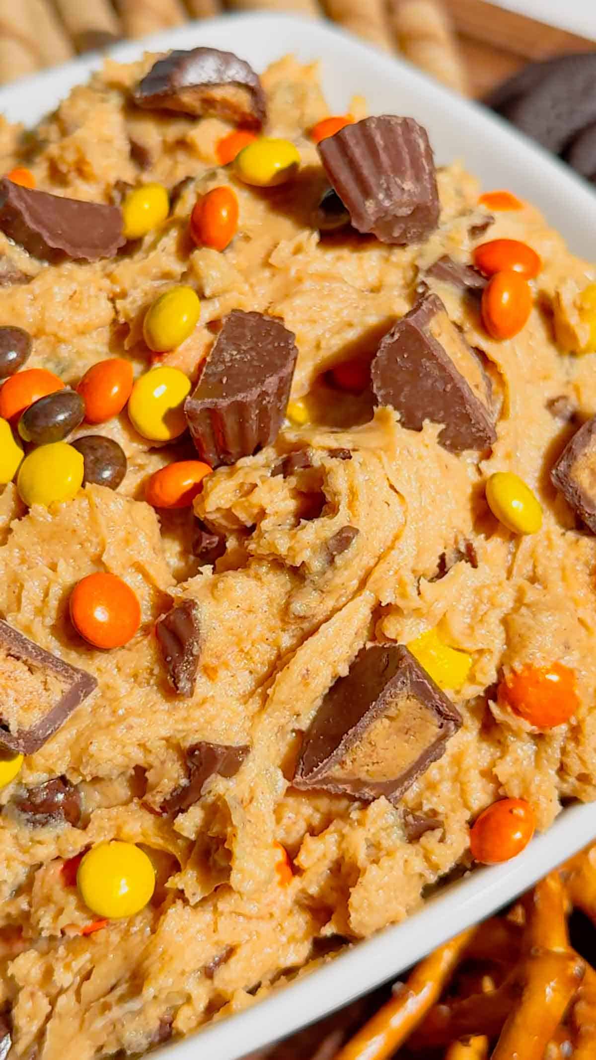 If you're looking for the ultimate Loaded Reese's Peanut Butter Dip, this easy no bake dessert is guaranteed to be a hit. Made with cream cheese, peanut butter, Cool Whip, brown sugar, Reese's Pieces, and chopped peanut butter cups, this creamy Peanut Butter Dip Recipe is rich, fluffy, and packed with chocolate and peanut butter flavor in every bite. It's the perfect Dessert Dip, Party Dip, No Bake Peanut Butter Dessert, and Reese's Dessert Recipe for game day, birthdays, potlucks, movie nights, holiday gatherings, or anytime you need a quick sweet treat. Serve it with graham crackers, pretzels, vanilla wafers, apple slices, or cookies for an irresistible snack everyone will keep coming back for. Save this easy peanut butter dessert recipe for your next party!