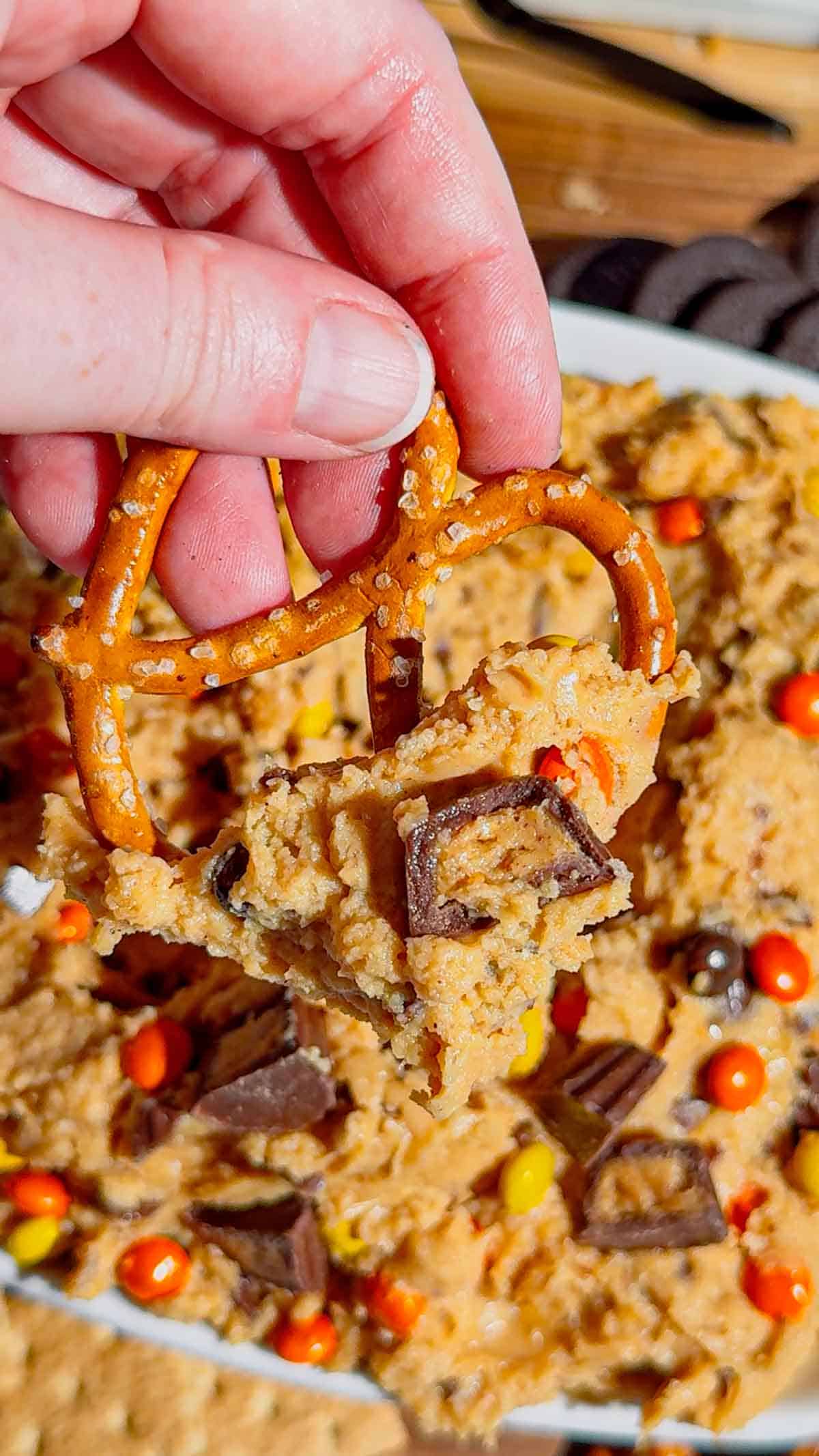 If you're looking for the ultimate Loaded Reese's Peanut Butter Dip, this easy no bake dessert is guaranteed to be a hit. Made with cream cheese, peanut butter, Cool Whip, brown sugar, Reese's Pieces, and chopped peanut butter cups, this creamy Peanut Butter Dip Recipe is rich, fluffy, and packed with chocolate and peanut butter flavor in every bite. It's the perfect Dessert Dip, Party Dip, No Bake Peanut Butter Dessert, and Reese's Dessert Recipe for game day, birthdays, potlucks, movie nights, holiday gatherings, or anytime you need a quick sweet treat. Serve it with graham crackers, pretzels, vanilla wafers, apple slices, or cookies for an irresistible snack everyone will keep coming back for. Save this easy peanut butter dessert recipe for your next party!