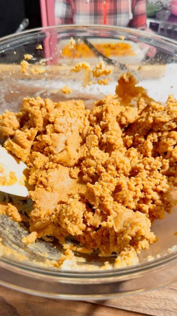 peanut butter and cream cheese mixture in a glass mixing bowl