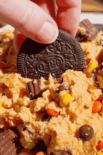 If you're looking for the ultimate Loaded Reese's Peanut Butter Dip, this easy no bake dessert is guaranteed to be a hit. Made with cream cheese, peanut butter, Cool Whip, brown sugar, Reese's Pieces, and chopped peanut butter cups, this creamy Peanut Butter Dip Recipe is rich, fluffy, and packed with chocolate and peanut butter flavor in every bite. It's the perfect Dessert Dip, Party Dip, No Bake Peanut Butter Dessert, and Reese's Dessert Recipe for game day, birthdays, potlucks, movie nights, holiday gatherings, or anytime you need a quick sweet treat. Serve it with graham crackers, pretzels, vanilla wafers, apple slices, or cookies for an irresistible snack everyone will keep coming back for. Save this easy peanut butter dessert recipe for your next party!