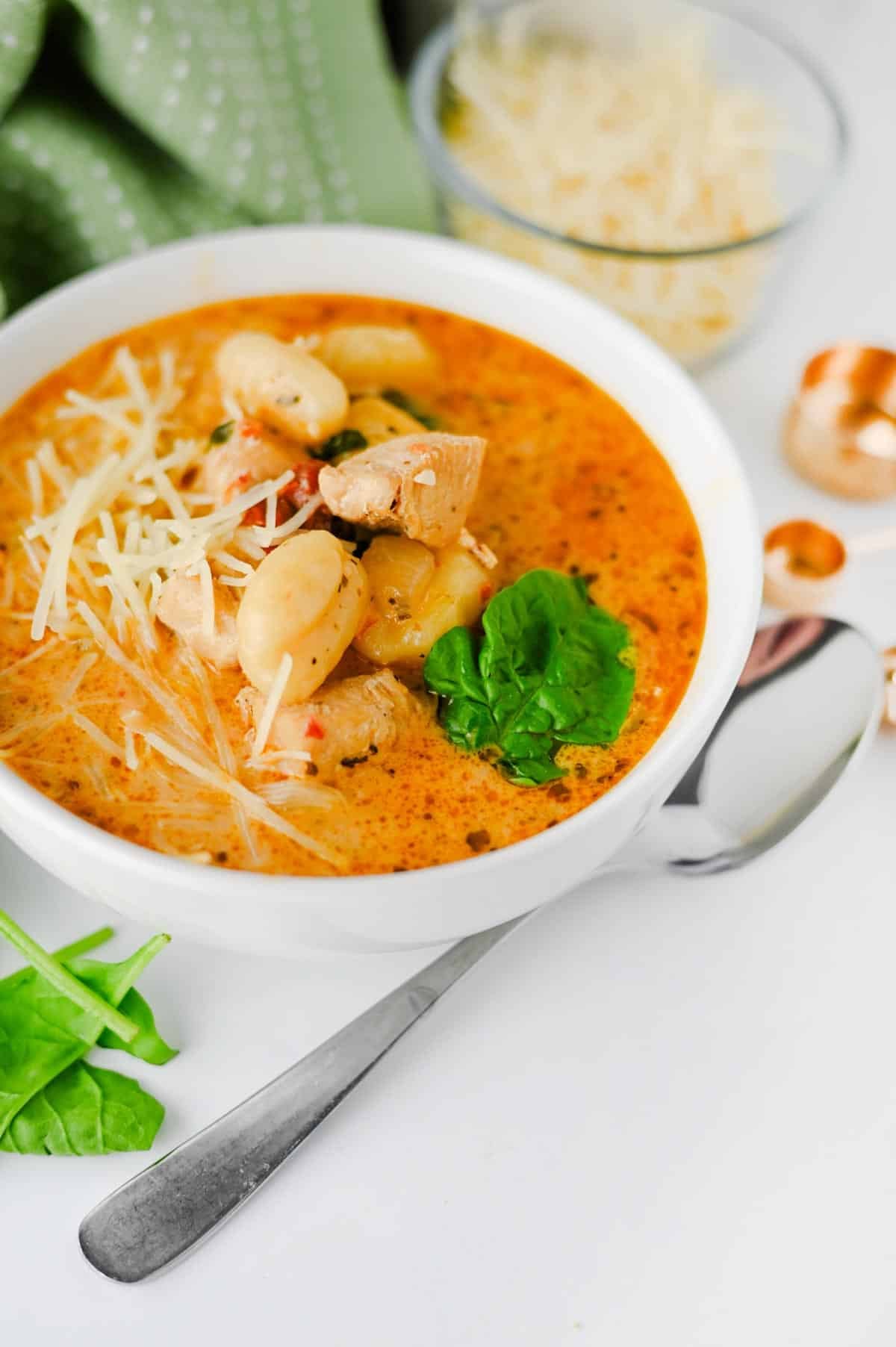 This Marry Me Chicken Soup is the cozy dinner for anyone craving a creamy, flavor-packed meal! Tender chicken, pillowy potato gnocchi, sun-dried tomatoes, spinach, pesto, Parmesan cheese, and heavy cream come together in a rich, savory broth that's impossible to resist. This easy Marry Me Chicken Soup Recipe is perfect for busy weeknights, chilly fall evenings, Sunday dinner, or whenever you need comforting Chicken Soup Recipes everyone will love. If you're searching for Creamy Chicken Soup, Gnocchi Soup Recipes, One Pot Dinner Ideas, Easy Chicken Dinner Recipes, hearty Fall Soup Recipes, or cozy Winter Soup Recipes, save this one! It's a satisfying creamy chicken gnocchi soup that's simple to make and loaded with big flavor. Save this easy soup recipe for your next comfort food dinner!