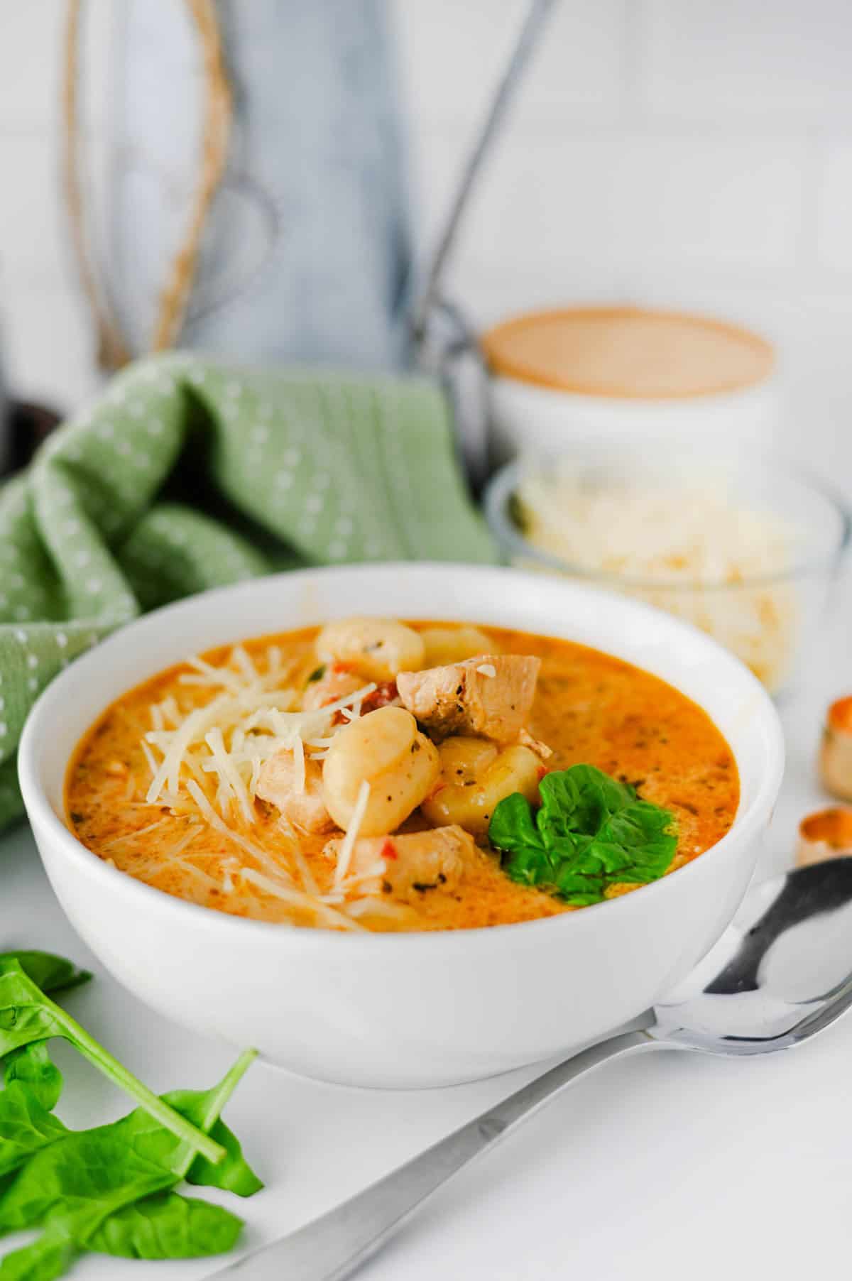 This Marry Me Chicken Soup is the cozy dinner for anyone craving a creamy, flavor-packed meal! Tender chicken, pillowy potato gnocchi, sun-dried tomatoes, spinach, pesto, Parmesan cheese, and heavy cream come together in a rich, savory broth that's impossible to resist. This easy Marry Me Chicken Soup Recipe is perfect for busy weeknights, chilly fall evenings, Sunday dinner, or whenever you need comforting Chicken Soup Recipes everyone will love. If you're searching for Creamy Chicken Soup, Gnocchi Soup Recipes, One Pot Dinner Ideas, Easy Chicken Dinner Recipes, hearty Fall Soup Recipes, or cozy Winter Soup Recipes, save this one! It's a satisfying creamy chicken gnocchi soup that's simple to make and loaded with big flavor. Save this easy soup recipe for your next comfort food dinner!
