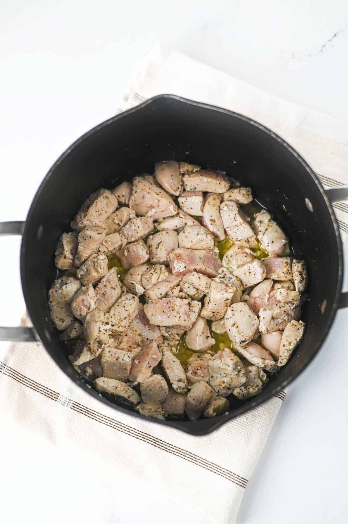 cooked chicken breast pieces in a pot